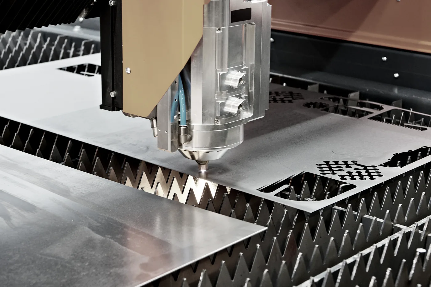 Laser-cut steel pattern — custom plates, clips and brackets cut to drawings
