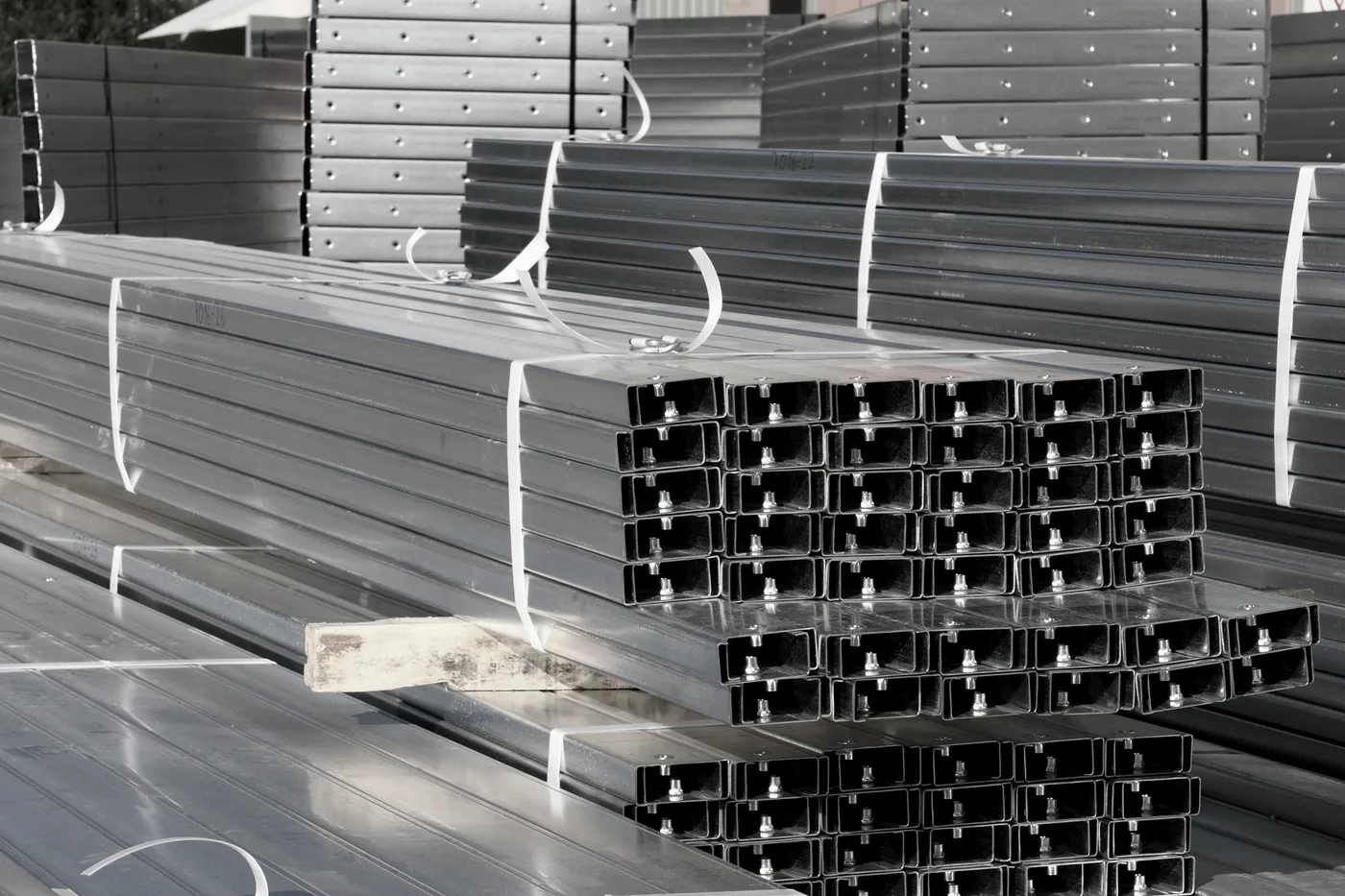 Stack of punched galvanized CZ purlins cut to length — Houston manufactured secondary framing